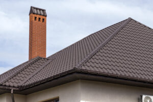 Close Up of a Metal Roofing System and Chimney